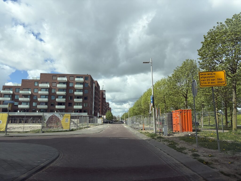 Road closure sign visible from the access road
